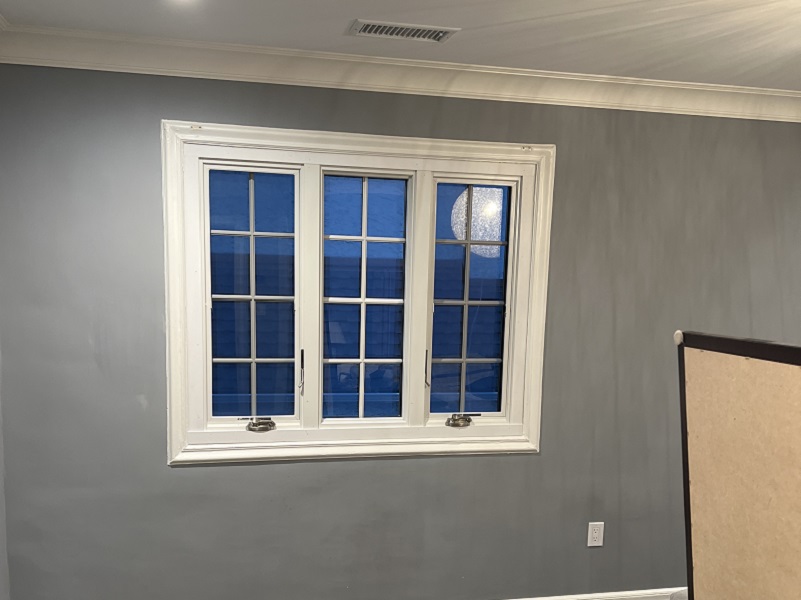Black casement window installation